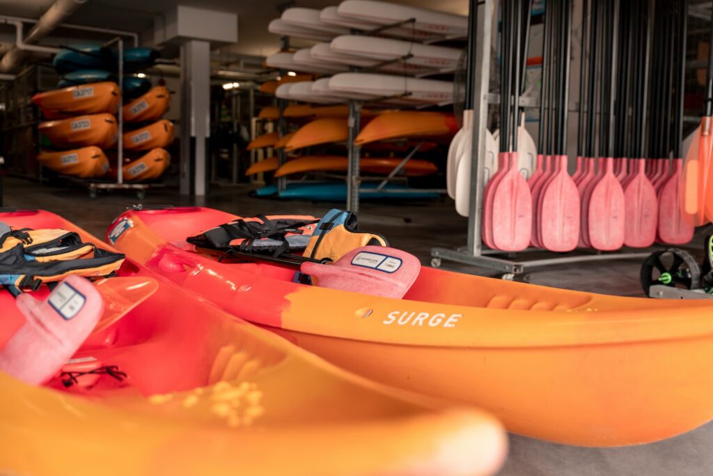 two orange-and-red kayak